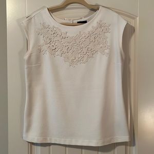 Beautiful cream embroidered top with button closure size large.